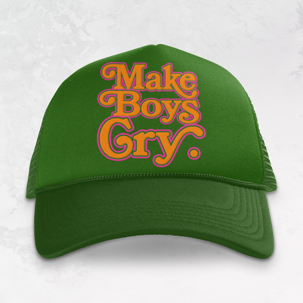 Green cap with 'Make Boys Gry' text on a orange and pink background
