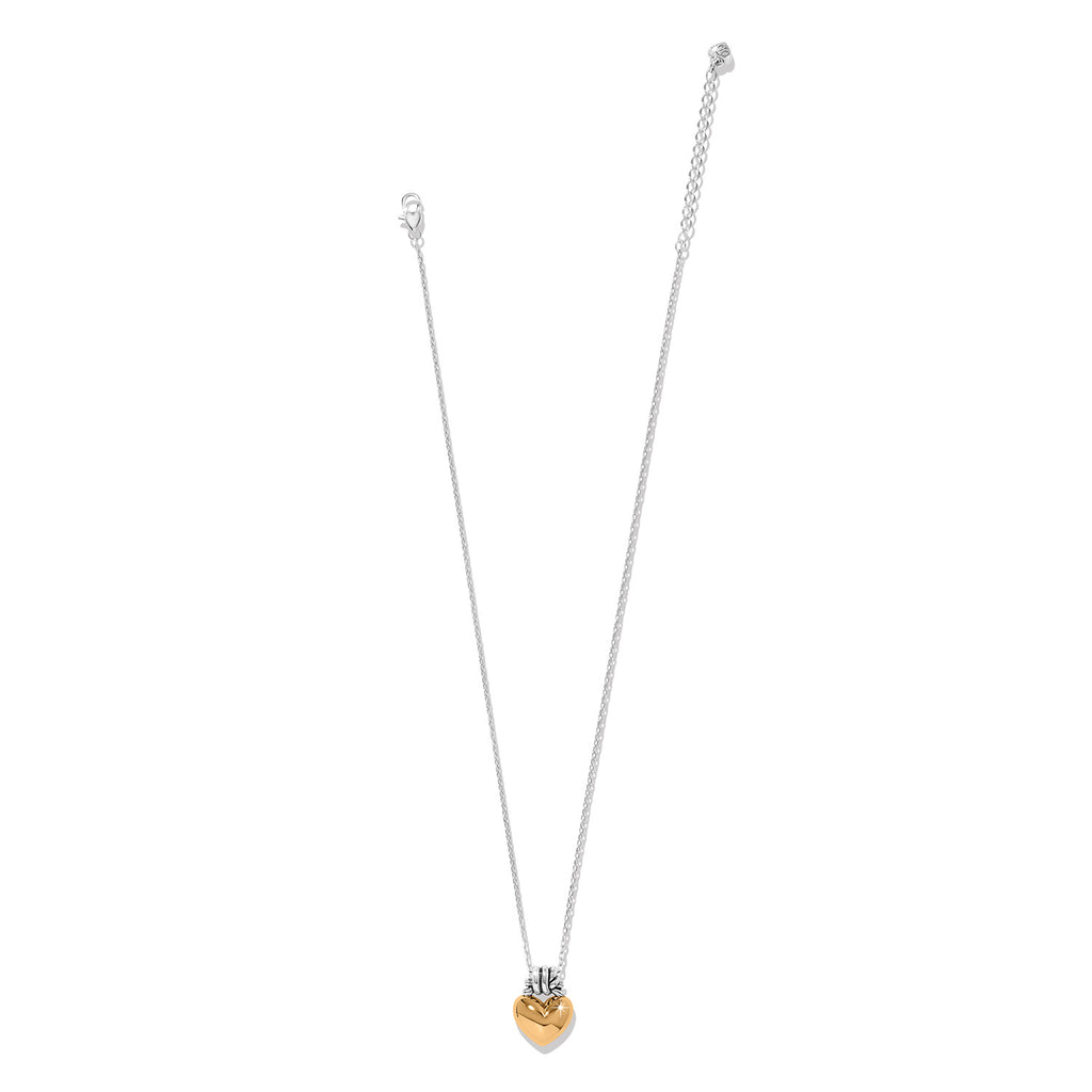 Gold heart-shaped pendant on a silver chain against a white background