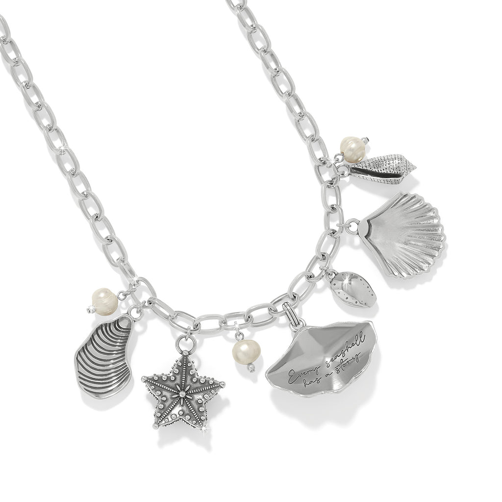 Necklace with various charms including shells and a starfish on a white background